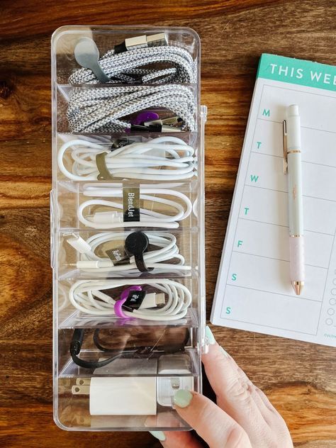 Are your charging cables and cords a tangled mess? Steal these easy ideas for organizing your cord clutter. Extra Cord Storage, Computer Cable Organization, Charger Organizer Diy, Charging Cord Storage, How To Organize Chargers Cords, Organizing Electronics Cords, Chord Organisation, Storing Chargers And Cords, Phone Charger Organization Ideas