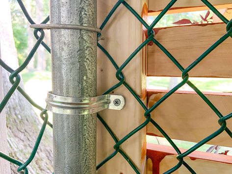 A close shot of the wood frame connected to the fence Hide A Chain Link Fence, Chain Link Fence Cover, Chain Link Fence Privacy, Chain Fence, Design Fence, Charlotte Smith, Fence Backyard, Fence Diy, Add Curb Appeal