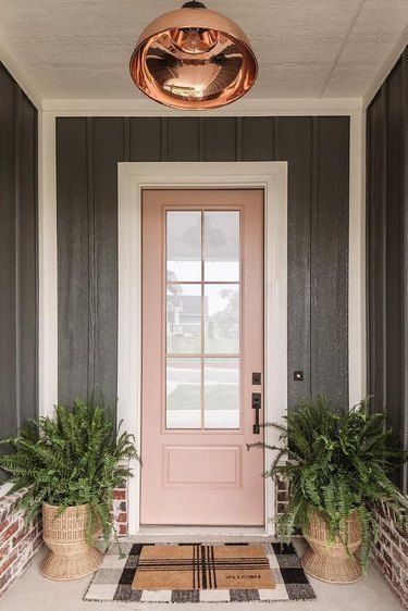 15 Front Door Colors That Go With a Gray House Exterior | Hunker Light Pink Door Exterior, California Casual Paint Colors, Colourful Front Doors, Pink Door Exterior, Peach Front Door, California Casual Home, Pink House Exterior, Red Brick Exteriors, Exterior Gray Paint