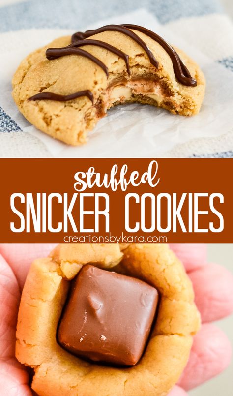 Love peanut butter? You'll go crazy for these PEANUT BUTTER SNICKERS COOKIES! Who can resist a chewy peanut butter cookie with a candy bar inside and melted chocolate on top? #snickercookies #snickerscookies #peanutbuttersnickercookies #snickersinside #cookieswithsnickers #candybarcookies -from Creations by Kara Snicker Bar Cookies, Peanut Butter Snickers Cookies, Snickers Peanut Butter Cookies, Snicker Cookies Recipes, Peanut Butter Snickerdoodle Cookies, Cookies With Snickers Inside, Gourmet Peanut Butter Cookies, Melted Butter Cookies, Cookies With Snickers