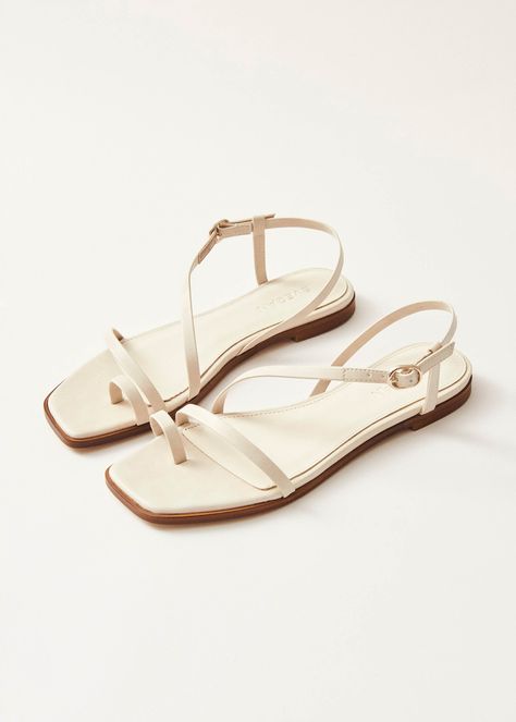 Cream vegan leather toe-ring flat sandals The Sloane sandals, in cream-colored vegan leather, boast slim straps wrapping the toe and instep, with an ankle fastening. They offer comfort with lightly cushioned soles and slight heels, making them the perfect choice for your summer footwear staple. Cream Sandals, Summer Footwear, Color Crema, Faroe Islands, Toe Ring, Summer Holidays, Samoa, It's Hot, Cayman Islands