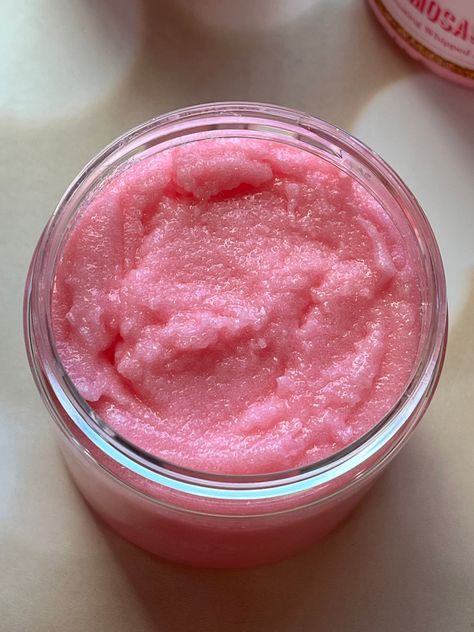 Fragrance: This scent smells like a celebration! It's a sweet and bubbly mix of peach, apple, cherry, strawberry, mandarin, and raspberry. It finishes with notes of iris, vanilla, moss, and musk What it does: This sugar scrub literally feels like silk on your skin. Gently massage onto wet skin for 10-15 seconds and feel the decadent smoothness. Emulsified sugar scrubs are enriched with Avocado Oil, Sunflower oil and Jojoba Oil. They hydrate, moisturize, and get rid of those dead skin cells to re Body Scrub Aesthetic, Fancy Skincare, Pink Body Scrub, Selfcare Products, Diy Body Scrub Recipes, Emulsified Sugar Scrub, Pink Mimosa, Career Goal, Foaming Sugar Scrub