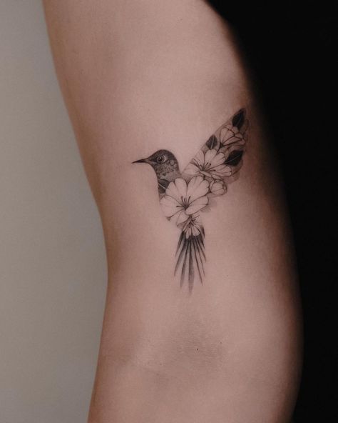 Flower Tattoo Designs Non Animal Tattoo, Cross And Hummingbird Tattoo, Floral Bird Tattoo Design, Bird Ribcage Tattoo, Wrist Bird Tattoos For Women, Bird Tattoo With Name, Bird Carrying Flower Tattoo, Hummingbird Tattoo Hand, Bird Thigh Tattoo