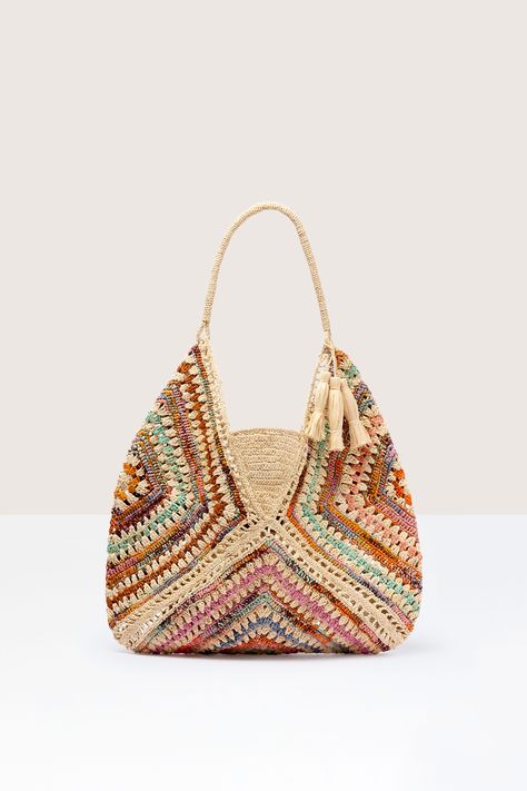 Hand-crafted in Madagascar, the Woven Bohemian Raffia Bag is a beautifully designed piece by Rabarany. Made from locally grown natural fibres like raffia, it features a deep tote shape and a tassel. With its natural colours and contrasting accents, this bag is the perfect accessory that seamlessly transitions from the beach to a dinner party. RABBNVL Crochet Bag Ideas Handbags, Rafia Bag, Crochet Raffia Bag, Sac Granny Square, Simpul Makrame, Crochet Boho Bag, Woven Purse, Crochet Classes, Bohemian Bags