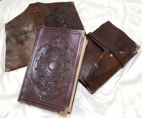 My hand carved leather books are done!!! Swipe for those good detail shots 👌🏻 . I'm going to keep the purple one for my own Caleb Widogast… Caleb Widogast Aesthetic, Wizard Oc, Caleb Widogast, Dnd Wizard, Oc Aesthetic, Mighty Nein, Aesthetic Board, Leather Books, Detail Shots