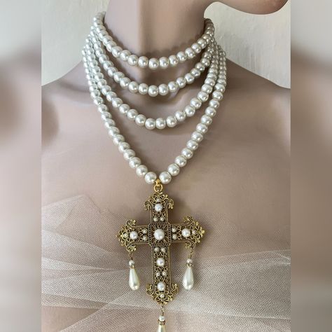 Multi strand pearl necklace with Baroque style cross. Make a statement wearing this unique piece. I offer the following varioations for this necklace 4 strands of Preciosa glass pearls 3 stands of Preciosa glass peals 3 strands of Preciosa glass pearls with silver crystal rondelle spacers 3 strands of Preciosa glass pearls with gold crystal rondelle spacers I offer this cross in gold or silver colours. The cross, has cabochon pearls and clear crystal glass chatons and 3 drop pearls hanging from Cross Necklace Layered, Cross Gold Necklace, Princess Photoshoot, Baroque Jewelry, Multi Strand Pearl Necklace, Cross Necklace Women, Cross Gold, Necklace Christian, Style Baroque