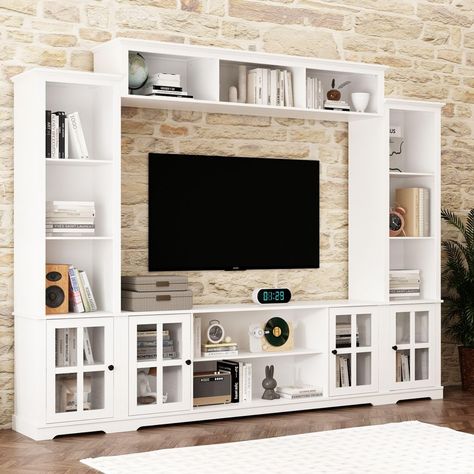 PRICES MAY VARY. Stylish & Chic - This entertainment center blend well with any themes of your living room due to its modernization and simplicity. Fully enclosed bookshelf storage and hutch space for TV set enriches the room entirely and improved space utilization. Functional & Practical - This large entertainment center features plenty of bookshelves and hutch for TV to maximize your storage space for your living room. The bottom shelves are adjustable to fit your items well and you can also r White Entertainment Center Living Room, Living Room Cupboard Ideas, Bookshelf Entertainment Center, Living Room Cupboards, Large Entertainment Center, Built In Shelves Living Room, Fireplace Entertainment Center, Living Room Entertainment Center, Modern Tv Wall