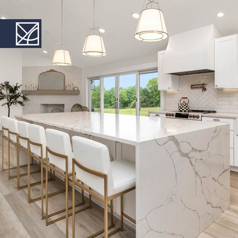 Our elegant 'Calacatta Noble Nuovo' is a popular quartz surface among builders for multi-unit projects and other commercial applications. Designed to mimic the luxurious appearance of natural Calacatta marble; 'Calacatta Noble Nuovo' Quartz is easy to clean and maintain. It does not require sealing, unlike natural marble, and is highly resistant to staining and etching. Quartz Waterfall Island, Marble Calacatta, Waterfall Island Kitchen, Waterfall Island, Quartz Surfacing, Calacatta Marble, Island Kitchen, Kitchen Reno, Kitchen Countertop