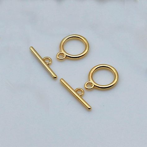 PRICES MAY VARY. · Package Content:15 sets. Hook Ring Toggle: about 15mm in diameter, 2mm thick, hole: 2mm, Tbar: 23mm long, hole: 2mm. Application: Perfect for making necklaces, bracelets, chokers, extenders, or anklets, friendship bracelets, Christmas bracelets, or neck chains, sweater clasps. Round Toggle Clasps: Made of Alloy, long-wearing and easy to preserve, with polished and professional finishing touch; Metal Color: Antique golden. Easy to Use: Toggle ring and bar design, you just need Bracelets Christmas, Making Necklaces, Toggle Necklace, Necklace Clasps, String Of Pearls, Christmas Bracelet, Jewelry Clasps, Neck Chain, How To Make Necklaces