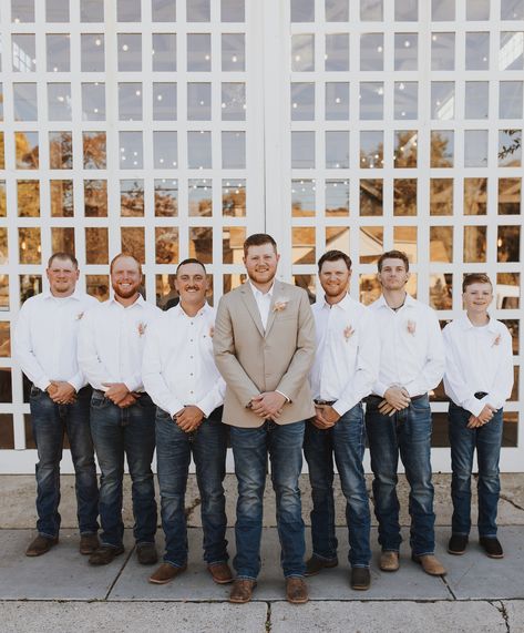 I’m takin’ your last name, cowboy⚡️ #caitlynwellsphoto #westernwedding #westernweddingphotographer #westernphotographer #westernphotography #westernengagement #westernbride #westernweddingmagazine #cowgirlmagazine #rockymtnbride #montanabride #utahweddingphotographer #utahweddings #northernutahphotographer #utahphotographer Groomsmen Jeans And White Shirt, Groom Jeans, Groomsmen Jeans, Groom In Jeans, Montana Bride, Long White Shirt, Party Jeans, Western Engagement, Tan Vest