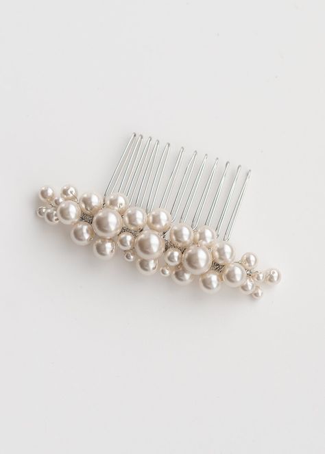 Poppy Pearl Bridal Comb has a perfect blend of beauty and elegance. This gorgeous headpiece is meticulously handcrafted with Austrian crystalised pearls. The pearls have been arranged to form it stunning shape, creating a beautiful comb. Handcrafted with attention to detail, this comb is the perfect accessory to complement your bridal look. Poppy is similar to the Pallas pearl comb but uses smaller pearls and is a small profile and comb. DETAILS - Austrian crystalized Pearls & Freshwater Pearls - Rhinestones - Silver (Rhodium), Gold or Rose Gold plated finish.  - Metal comb - Size 8.5cm L x 2.5cm W - Customisation available  All of our products are created entirely by hand in our studio. Designed and handmade in Australia. HANDMADE TO ORDER Production timeframe 5-7 business days  Plus post Pearl Headpiece Wedding, Pearl Hair Comb Wedding, Pearl Bridal Comb, Pearl Comb, Pearl Bridal Headpiece, Wedding Hair Clip, Wedding Comb, Pearl Headpiece, Bride Headpiece