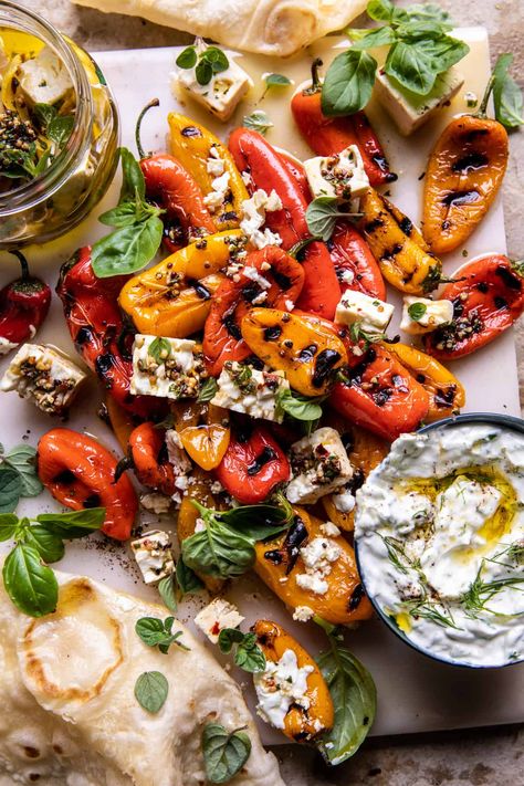 Charred Peppers with Marinated Feta and Tzatziki. - Half Baked Harvest Charred Peppers, Marinated Feta, Vegetable Ideas, Roasted Olives, Half Baked Harvest Recipes, Grilled Peppers, Bbq Sides, Whipped Feta, Harvest Recipes