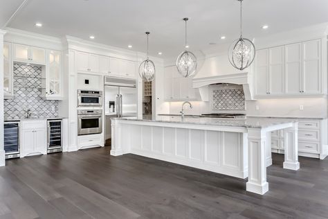 White kitchen inspiration, oversized island, white cabinets, wood floors, glam, elegant, neutral decor Kitchen Lighting Remodel, Beautiful White Kitchens, Kitchen Remodel Inspiration, New Kitchen Cabinets, White Kitchen Design, Kitchen Remodeling Projects, White Kitchen Cabinets, Large Kitchen, Counter Tops