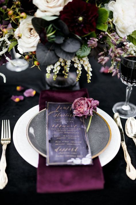 Create a romantically spooky feel for your Halloween-inspired wedding with a black and deep purple color palette. Pops of gold on the menu lettering and silverware provide a sophisticated metallic accent. | Moody Jewel-Toned Halloween Wedding Inspiration Shoot | #equalitymindedweddings #lgbtweddingmagazine #loveinc #halloweenwedding #halloween #blackpurplewedding #halloweenphotoshoot Colourful Christmas, Jewel Tone Wedding, Purple Color Palettes, Dark Wedding, Moody Wedding, Marriage Ceremony, Gothic Wedding, Halloween Wedding, Deco Table