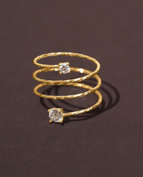 Introducing our exquisite Gold Wire Full Finger Ring, designed for those who appreciate statement jewelry. Crafted with precision, this Long Spiral Wire Ring in luxurious gold plating exudes elegance and sophistication. The unique spiral design gracefully wraps around your finger, adding a touch of glamour to your ensemble. Adorned with sparkling Cubic Zirconia accents, this 14K gold-plated ring truly stands out. Make a style statement and let your inner beauty shine with this one-of-a-kind and Gold Ring Modern Design, Spiral Finger Rings Gold, Finger Rings Designs Gold, Spiral Rings Gold, Engment Ring, Modern Gold Jewelry Unique Designs, Gold Finger Rings Unique, Gold Ring Designs Unique For Women, Ring Designs Gold For Women