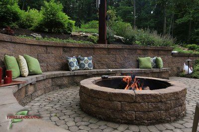 Paver Fire Pit, Backyard Retaining Walls, Fire Pit Seating Area, Pavers Backyard, Fire Pit Landscaping, Sloped Backyard, Landscaping Retaining Walls, Fire Pit Seating, Fire Pit Area