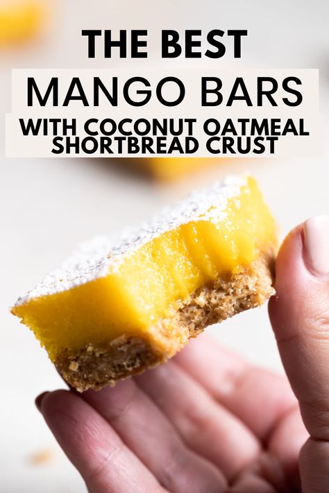 A hand holding up a mango bar with a bite taken out of it with the words "the best mango bars with coconut oatmeal shortbread crust" in the foreground Recipes Using Mango Puree, Recipes With Mango Puree, Mango Baking Recipes, Mango Puree Recipe Desserts, Healthy Mango Recipes, Mango Nectar Recipes, Oatmeal Shortbread, Bars With Coconut, Mango Bars