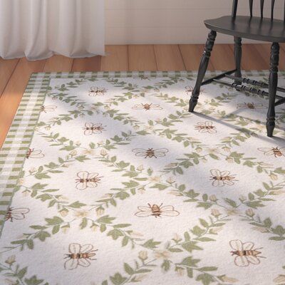 If you feel you’ve been bumbling around for the perfect carpet, look no further! Depicting a group of merry honey bees, this Littell Hand-Hooked Wool Green Area Rug provides warmth to bare hardwood floors while adding a pop of color to your ensemble. Hand-woven from wool, this design’s hooked weaving technique, and cotton backing add underfoot comfort. A rug pad is recommended for added traction, and professional cleaning is recommended in case of any staining. Rug Size: Round 4' | Brown / Green Bee Rug, Farmhouse Kitchen Rugs, Sage Green Rug, Hand Hooked Wool Rug, Falafels, Yellow Hues, Hooked Wool, Rug Size Guide, Green Area Rug