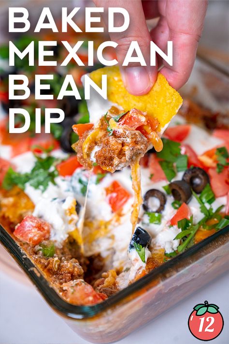 Baked Mexican Layer Dip | 12 Tomatoes Baked Mexican Dip, Layered Mexican Dip Recipe, Layered Mexican Dip, Mexican Bean Dip, Mexican Dip Recipes, Mexican Layer Dip, Seasoned Sour Cream, Mexican Dip, Mexican Dips