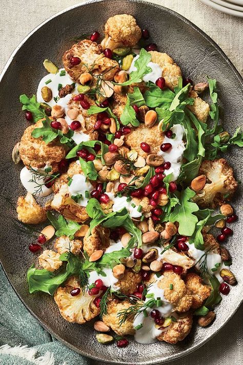 This quick and easy 35-minute cauliflower salad recipe incorporates yogurt sauce and pomegranate seeds to create the ultimate weeknight dinner recipe meets salad recipe.#saladrecipes #wintersalads #wintersaladrecipes #cauliflowerrecipes #sidedishes #sidedishrecipes Raw Salad Recipes, Pomegranate Recipes Salad, Cauliflower Salad Recipe, Roasted Cauliflower Salad, Zesty Salad, Winter Salad Recipes, Pomegranate Recipes, Pomegranate Salad, Cauliflower Salad