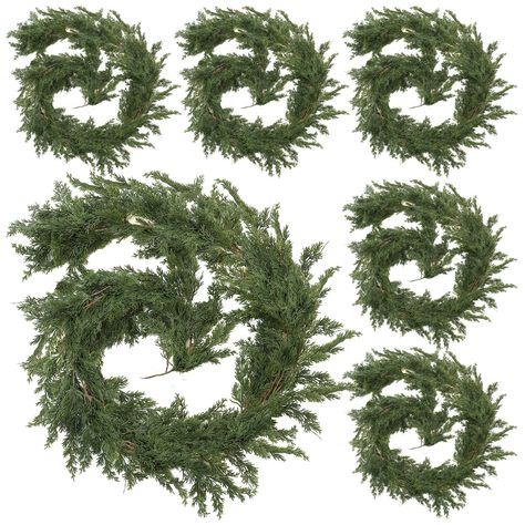 PRICES MAY VARY. What Can You Get: 6 pieces of 9ft long Christmas cedar garland, sufficient amount and length to meet your home or outdoor decoration needs, creating an intense festive atmosphere for your home Infuse a Festive Feeling: the leaves are layered so that the Christmas greenery garland looks layered and charming, full of the breathing of Christmas, will add charm to your house during the Christmas season Proper Size: each cypress garland artificial realistic is about 72 inches/ 183 cm Christmas Dining Table Decorations, Christmas Garland On Stairs, Porch Garland, Archway Decor, Fireplace Table, Cypress Vine, Cedar Garland, Christmas Dining Table Decor, Christmas Stairs