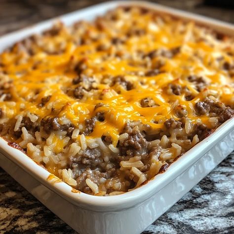 Cheesy Hamburger Rice Casserole Minute Rice Hamburger Casserole, Hamburger Crumble Recipes, Hamburg Rice Recipes, Cheesy Hamburger And Rice Casserole, Rice Hamburger Hotdish, Hamburger Rice Hot Dish, Rice With Ground Beef Recipes, Hamburger Casseroles Easy, Burger And Rice Recipes