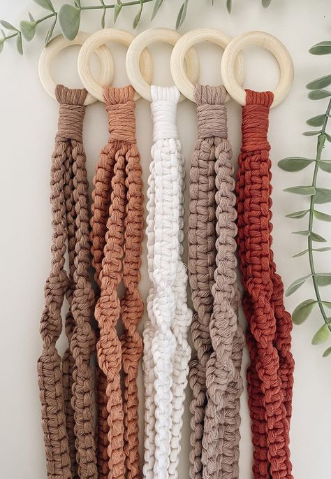 Give your space some color with these muted handmade macrame plant hangers.  You just need to add some greenery!  Proudly made in Canada Lengths of each hanger is measured with NO pot from wooden ring to gathering knot. Please keep in mind these are handmade...tassel lengths and gathering knots will vary to help reduce waste  **Also note there is no tracking number with this shipment ** Thank you and please don't hesitate to ask me any questions! -Destinee Macrame Photography, Boho Crafts Diy, Macrame Knots Pattern, Plant Decor Indoor, Macrame Plant Hangers, Macrame Ideas, Macrame Decor, Macrame Art, Macrame Projects