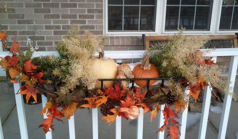 Fall Planters: Use railing planters from summer for fall decorations by wrapping leaf garland around edge of planter and include pumpkins. This one left some green plant on the two ends from the summer plants and included small gourds and pumpkins. The planter will be removed after thanksgiving. Fall Deck Railing Planters, Fall Deck Ideas For The Home, Fall Porch Railing Decorating Ideas, Fall Railing Planter Ideas, September Decorations, Deck Railing Planters, Fall Deck, Holidays Decorations, Fall Front Porch Ideas