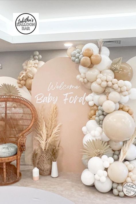 Boho baby shower vibes 😍 this installation used our #trendy Chiara walls w/personalization and we added pampas, palm leaves and florals to the neutral toned balloon garland ➡️swipe to see a closer pic Boho Neutral Balloon Arch, Balloon Arch With Palm Leaves, Boho Beach Balloon Garland, Pampas Balloon Garland, Boho Baby Shower Balloon Arch, Pampas Grass Balloon Garland, Baby Shower Ideas Boho Girl, Balloon Garland With Pampas, Boho Theme Baby Shower Ideas