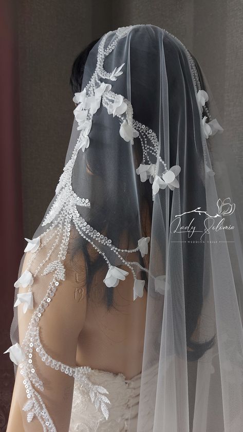 "Elegant flowers pearl wedding veil with beads and sequins. In her the bride will look mysterious and romantic. The veil is made of high-quality materials and expensive 3D floral lace. There is a comb at the top of the veil to secure it on the head. This veil is available in a variety of lengths. I can make custom veil for you with length and width that you specify from the style you like. If you have any questions please send me a message, I will be happy to discuss details. Width 60 \" (150cm) Veil With Pearls And Flowers, Luxury Elegant Bridal Accessories For Ceremony, Wedding Day Accessories For Bride, Luxury Traditional White Wedding Accessories, Luxury Romantic Veil For Ceremony, Wedding Hair For Bride Veil, Luxury Bridal Accessories For Wedding, Luxury Romantic Veil, Tiara Plus Veil