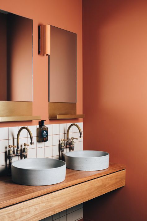 Naughtons Hotel | Alana Cooke + Hearth Studio | Melbourne Corten Bathroom Design, Orange Terrazzo Bathroom, Rust Bathroom Tiles, Terracotta Bathroom Ideas, Orange Bathroom Ideas, Bathroom Orange Tile, Burnt Orange Bathroom, Orange Sink Bathroom, Small Bathroom Tile