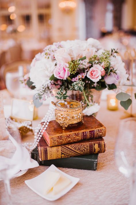 Reception Table Setting Flowers Pearls Vintage Books Candles Opulent Pink Gold Victorian Wedding in Seattle http://www.barrieannephotography.com/ Wedding Table Decorations White, Victorian Wedding Decor, Victorian Theme Party, Gold Table Settings, Victorian Style Wedding, Gold Table Setting, Book Centerpieces, Reception Table Settings, Literary Wedding