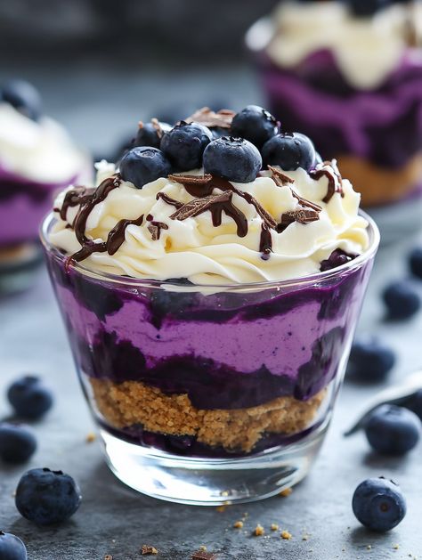 Blueberry Cheesecake Parfait   Ingredients: 400 g frozen blueberries (14 oz / 2¾ cups) 🫐 2 tablespoons lemon juice 🍋 2 tablespoons sugar 🍚 125 g digestive biscuits (4.4 oz) 🍪 42 g unsalted butter, melted (3 tablespoons) 🧈 180 g white chocolate (6.3 oz / roughly 1 cup chopped) 🍫 125 ml whipping cream (½ cup) 🥛 250 g low-fat cream cheese, softened (or full-fat) (8.8 oz / 16.5 tablespoons) 🧀 125 ml low-fat sour cream, room temperature (or full-fat) (½ cup) 🥛 1 teaspoon vanilla extract 🍦 Blueberry Cheesecake Parfait, Blueberry Parfait, Chocolate Covered Blueberries, Cheesecake Parfait, Easy French Recipes, Cheesecake Parfaits, Cream Room, Digestive Biscuits, Blueberry Cheesecake