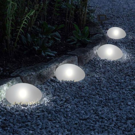 PRICES MAY VARY. Set of 4 Solar Pebble Lights: Design in stone shape, these decorative solar lights include cool white LEDs cast for safe, soft and mood-enhancing glow. Decorate your garden with these modern solar outdoor pebble lights. Dusk to Dawn: These stone lights will automatically turn on the light at dusk (ensure the switch is in “ON” position) and automatically charge during the day. The time of working and charging depends on the sunlight. Material & Dimension: Made of glass top and pl Solar Tree Lights, Backyard Solar Lights, Solar Driveway Lights, Backyard String Lights, Decorative Solar Lights, Rock Lights, Solar Spot Lights, Driveway Lighting, Glow Stones