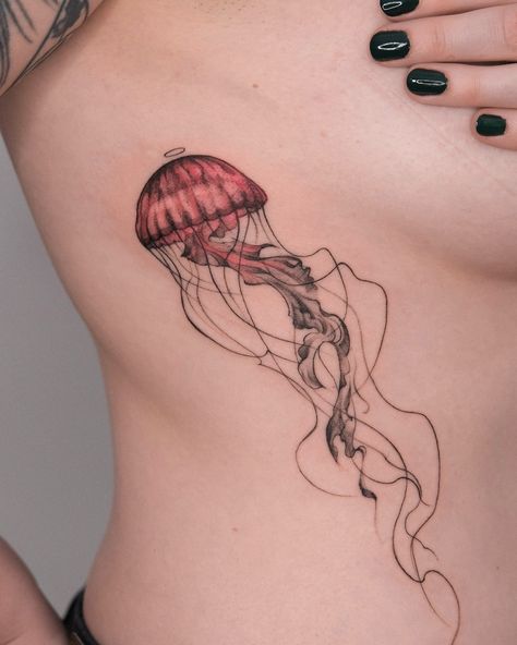 The jellyfish swims peacefully ⭕️ Thank you Denise for your trust 🌸 . . . . #jellyfishtattoo #animaltattoo #sketchtattoo #colortattoos #jellyfish #sketchbook #abstractattoo #lineworktattoo #tattooanimal #berlintattooers #berlintattooartist #berlintattoo #osmanergin Jellyfish Shin Tattoo, Red Ink Jellyfish Tattoo, Jellyfish Rib Tattoo, Red Jellyfish Tattoo, Matching Jellyfish Tattoos, Fine Line Jellyfish Tattoo, Colored Tattoos On Dark Skin, Jellyfish Sketchbook, Jellyfish Tattoo Color