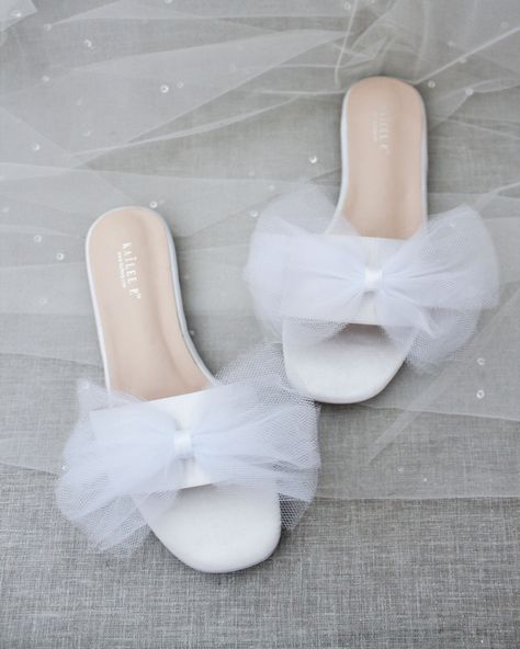 "Classic slide flat sandals for casual and dressy look with added oversized tulle bow. Simple and easy wear for brides, bridesmaids and/ or wedding parties. DETAILS: COLORS AVAILABLE: White, Off White and Ivory UPPER: Synthetic upper and lining MATERIALS: Mandmade outsole - Please see our \"Policies\" section for information regarding RETURNS and EXCHANGES. - Stay updated with latest news or promotion as we grow and follow us on the following outlets: Instagram: http://instagram.com/shop.kaileep Bridesmaids Sandals, Bridesmaid Sandals, Bride Sandals, Wedding Slippers, Tulle Bow, Wedding Shoes Bride, Tulle Bows, Wedding Flats, Bridal Sandals