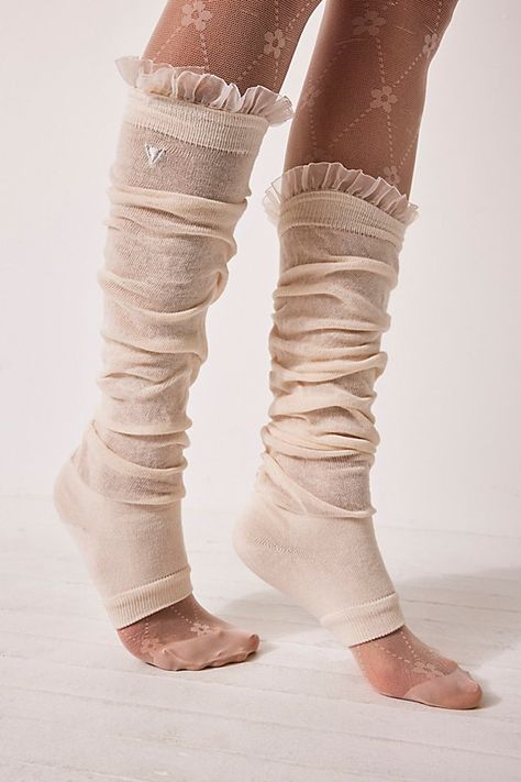 Dance on with these so soft, vintage leg warmers, featuring sweet ruffle trim for an ultra femme detail. **Fit:** Over-the-knee length, fitted heel**Features:** Cotton knit fabrication, multi-wear, ruffle trim**Why We <3 It:** Oh-so versatile, these soft leg warmers can be worn for barre class or as a layering piece for transition season looks. Soft Legs, Tall Socks, Free People Activewear, Leg Warmer, Sofia Coppola, Cotton Knit, Boho Clothing, Leg Warmers, Ruffle Trim