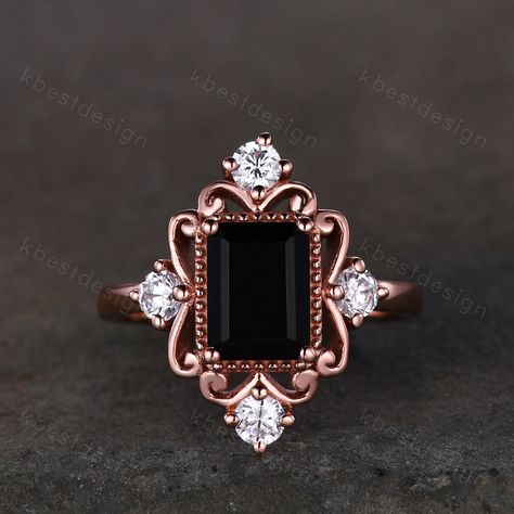 This is a Vintage black onyx engagement ring 6x8mm emerald cut black onyx ring unique antique moissanite ring black stone ring rose gold Bridal ring Main Stone: 6x8mm emerald cut natural black onyx Side stone: Moissanite This ring is marked S925/G10K/G14K/G18K (According to the metal option) I accept custom making order.Please contact me if you need this service. For all the jewelries,there is a 14 days money back guarantee.You can return it in the time frame without any questions.However there Colored Engagement Ring, Yellow Gold Moissanite Ring, Ring Black Stone, Wedding Rings Emerald Cut, Vintage Opal Engagement Ring, Black Agate Ring, Rose Gold Opal Ring, Moissanite Wedding Ring Set, Black Onyx Engagement Ring