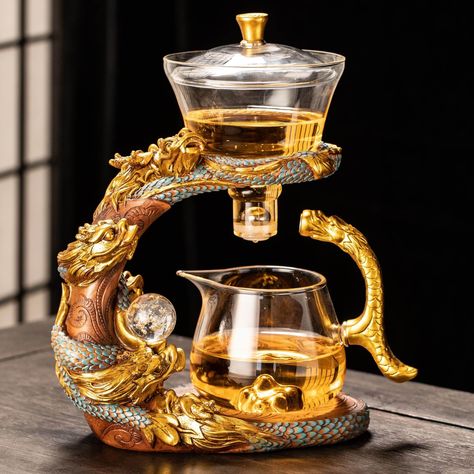 PRICES MAY VARY. PACKAGE INCLUDED: Tea set base*1, sharing pot*1, tea bowl (hill)*1. MATERIAL: This glass tea pot set is made of borosilicate glass which is durable. FEATURES: The dragon sculpture frame and cups of the tea set can be separated easily. Stainless steel filter can effectively filter tea residue. DRAGON TEA SET: The glass teapot is suitable for for enjoying scented tea, loose leaf tea, tea bags and fruit tea. GIFT: You can enjoy afternoon tea time at your home, office, and party, an Tea Station At Home, Tea House Interior, Tea Package Design, Victorian Tea Sets, Tea Room Decor, Elegant Tea Set, Glass Tea Pot, Elephant Teapot, Tea Loose Leaf