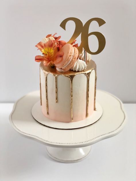 Peach to white gradient cake. Gold drip. Macarons, flowers, and meringues on top in a crescent arrangement. Gold topper reads “26”. Cute 26th Birthday Cake, Peach Colour Birthday Cake, Peach Colored Cake Ideas, 26 Th Birthday Cake, Birthday Cake 26th Birthday Girl, Cake For 27th Birthday, Cake 26 Birthday Woman, 27th Birthday Cake Ideas For Women, 26th Birthday Cake Ideas For Him