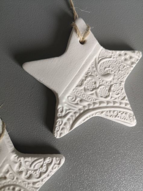 This set is lovingly handmade from quality air dry clay. Click the link for matching personalized stars:  https://www.etsy.com/uk/listing/997047441/personalized-christmas-tree-decoration?ref=shop_home_recs_16&crt=1 Click the link for matching 2021 clay stars:  https://www.etsy.com/uk/listing/1064936163/set-of-three-2021-christmas-tree?ref=shop_home_recs_20 Please note that this item is not waterproof so its only for indoor use. Only use clean, dry cloth to clean it. Air Dry Clay Christmas Baubles, Poly Clay Christmas Ornaments, Christmas Ornaments Ceramic Clay, Air Dry Clay Ideas Gifts, Handmade Clay Christmas Decorations, Pottery Christmas Tree Decorations, Holiday Clay Projects, Ceramic Xmas Ornaments, Clay Decorations Christmas