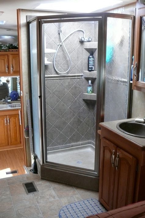 Looking to upgrade your RV Shower? View our favorite simple and affordable ways to upgrade and make your bathroom feel like new. Homemade Shower Cleaner, Rv Water Heater, Camper Bathroom, Rv Bathroom, Rv Water, Camping Shower, Trailer Remodel, Rv Remodel, Bathroom Remodel Shower