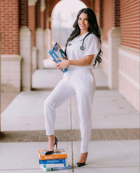 Nursing Degree Pictures, Nurse Grad Outfit, Nurse Student Photoshoot, Med Student Graduation Pictures, Scrub Graduation Photoshoot, Cap And Gown Nursing Pictures, Nursing School Headshots, Nursing Graduation Pictures With Books, Nurse Studio Photoshoot