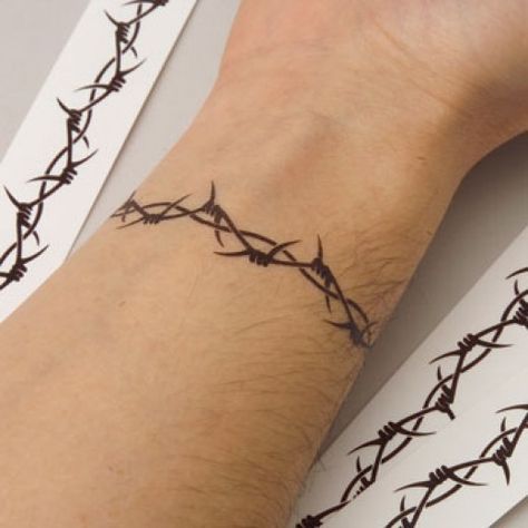 #Barbed Wire Tattoo on Wrist  http://shakeitup.hubpages.com/hub/BarbedWireTattoos Tattoos Pulseras, Barbed Wire Tattoo, Wire Tattoo, Thorn Tattoo, Barbed Wire Tattoos, Omerta Tattoo, Star Tattoo Designs, Wrist Tattoos For Guys, Arm Band Tattoo