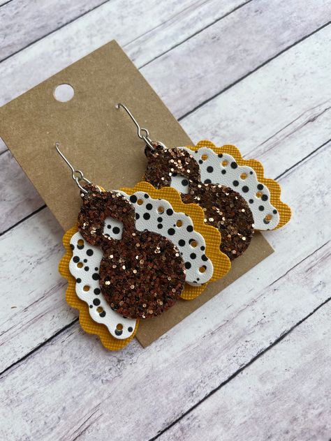 The cutest turkey earrings Made with stainless steel earring findings and faux leather (single-sided). Each pair of earrings will be slightly different because of the variability in the faux leather pattern.  2.5 inches long by 1.875 inches wide. Free shipping on orders $35 and over! Warning: Choking Hazard. Small Parts. Keep out of reach of children under 5 years old. Unique Faux Leather Earrings, Thanksgiving Earrings Diy, Halloween Faux Leather Earrings, Faux Leather Earring Ideas, Fall Faux Leather Earrings, Christmas Faux Leather Earrings, Leather Christmas Earrings, Diy Faux Leather Earrings, Leather Earrings Diy