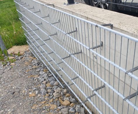 Practical stone cladding from gabions | GabionyLemon.com Gabion Wall Architecture, Sloped Landscaping, Gabion Wall Design, Gabion Ideas, Gabion Walls, Gabion Stone, Gabion Fence, Landscaping A Slope, Cinder Block Walls