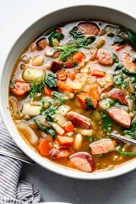 This easy Kielbasa Soup recipe is filled with savory sausage, hearty potatoes, and healthy vegetables. It’s a warm and comforting soup that’s perfect for a cold winter day. // recipes healthy // Turkey Kielbasa Recipes, Soup With Beans, Kielbasa Soup, Lentil Sausage Soup, Sausage Soup Recipes, Kielbasa Recipes, Kielbasa Sausage, Comforting Soup, Sausage Soup