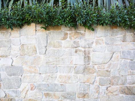 Close view of Eco Outdoor Coolum random ashlar limestone walling. Entrenched Landscapes | Eco Outdoor |… Eco Outdoor Stone, Natural Stone Garden Wall, Hamptons Retaining Wall, Stone Veneer Wall Exterior, Natural Stone Retaining Wall Ideas, Stone Veneer Retaining Wall, Garden Wall Cladding Ideas, Natural Stone Wall Outdoor, Stone Wall Outdoor Fence