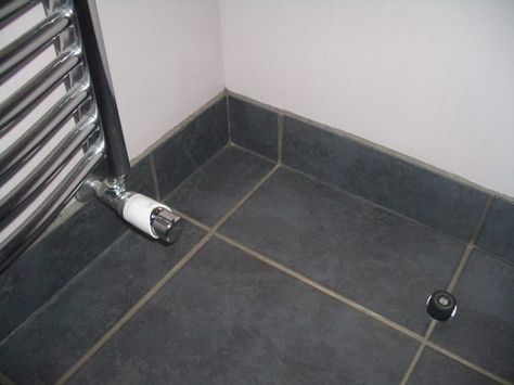 Tiling a floor - under or up to the skirting board? - Tile Skirting, Tile Baseboard, Floor Skirting, Ensuite Design, How To Tile, Grey Floor, Grey Floor Tiles, Bathroom Ensuite, Bathroom Remodel Tile