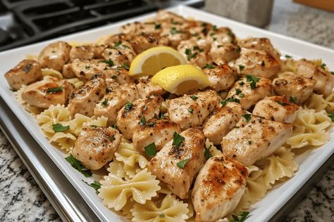 Savor Lemon Garlic Chicken Bites with Creamy Bowtie Pasta—a delicious, easy recipe perfect for family dinners. Ready in just 30 minutes! Lemon Garlic Chicken Bites With Creamy Bowtie Pasta, Chicken And Bowtie Pasta Recipes, Creamy Bowtie Pasta, Creamy Lemon Chicken Pasta, Chicken Bowtie Pasta, Garlic Chicken Bites, Bow Tie Pasta Recipe, Lemon Chicken Pasta, Lemon Butter Chicken